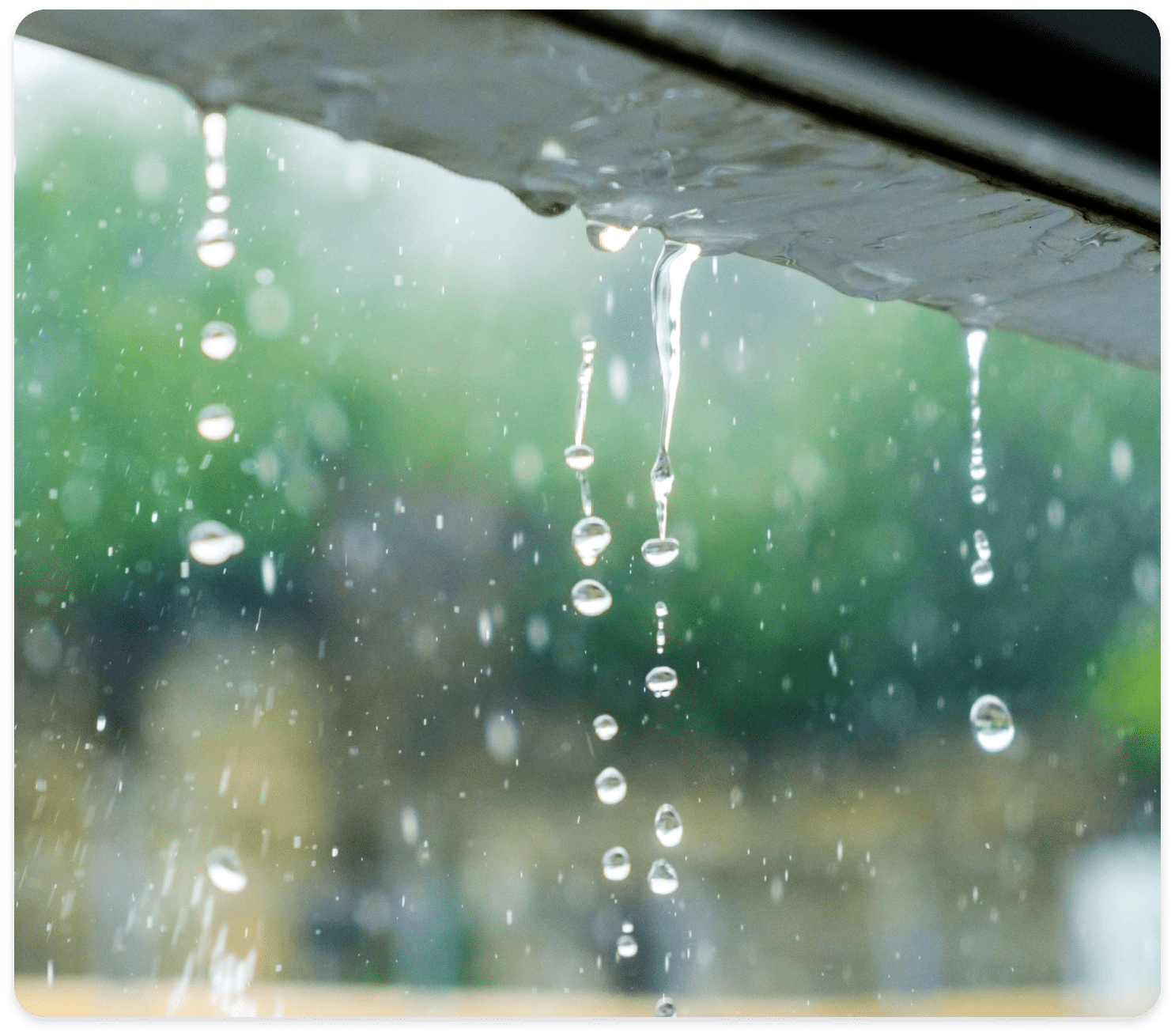 Rain Water Dripping off a Gutter